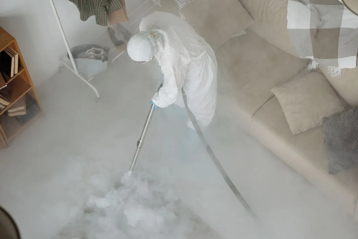 Biohazard cleanup technician in protective equipment, Devils Lake, ND